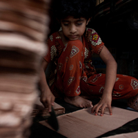 Neela, 6, is an earning member of her family as well as a student at Amader Pathshala. 