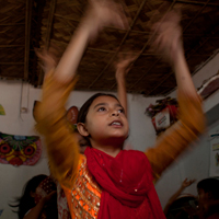 Laboni, 11, a student from Geneva camp at Mirpur, dances on Culture Day.