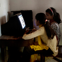 Students use computers at Amader Pathshala.