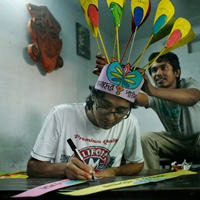 Kazi Muntasir Mishu, the science teacher, makes preparations for the New Year festival. 